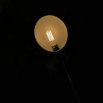 Photo exposed bulb reading lamp decor