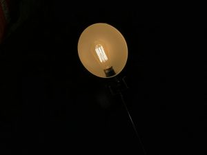 Photo exposed bulb reading lamp decor