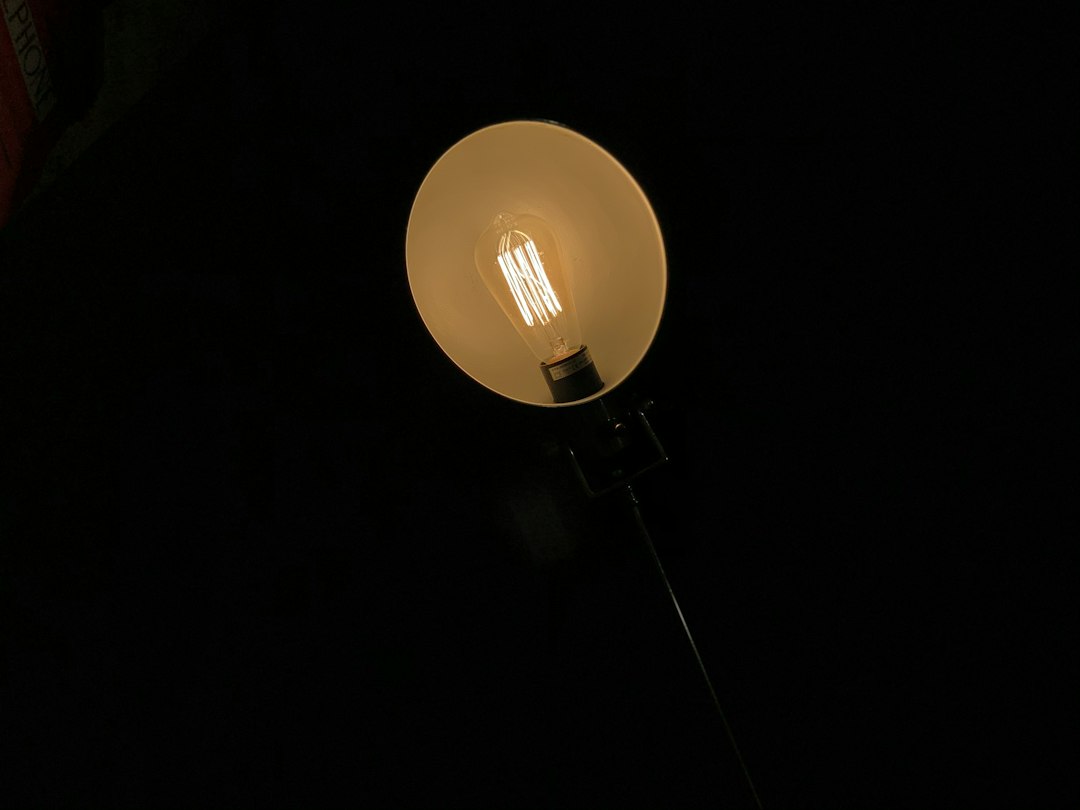 Photo exposed bulb reading lamp decor